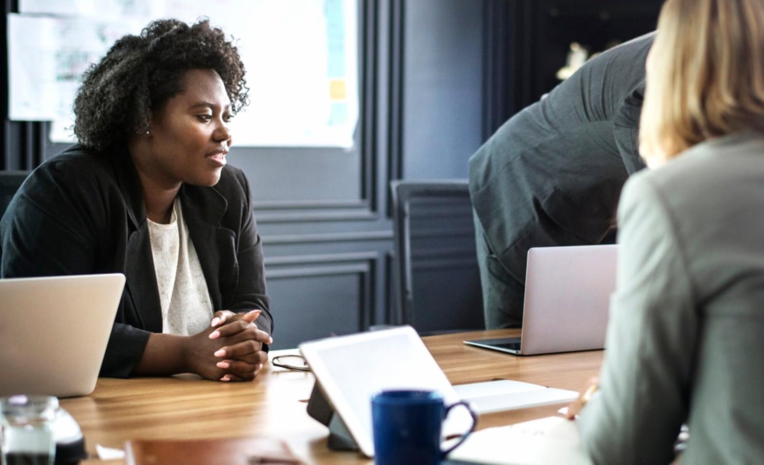 Professional meeting discussing investment strategies and financial planning documents